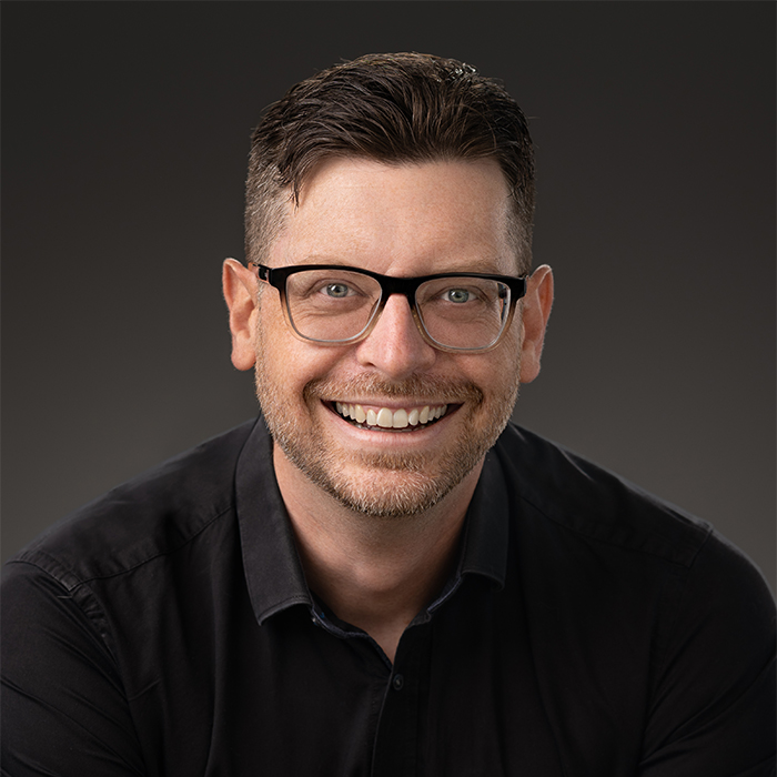 Headshot of Travis Bolten vy Crain Photography